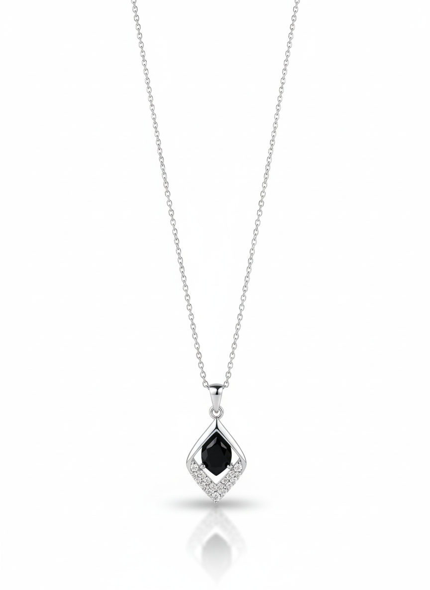 A sterling silver necklace with a stylized heart pendant that has a flame-like accent on one side. The necklace is displayed against a soft neutral background.