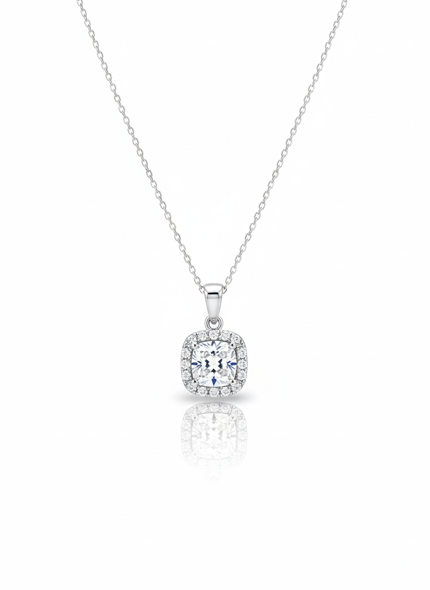 A sterling silver necklace with a solid, round disc pendant that has a rough, stone-like texture. The necklace is displayed against a soft neutral background.